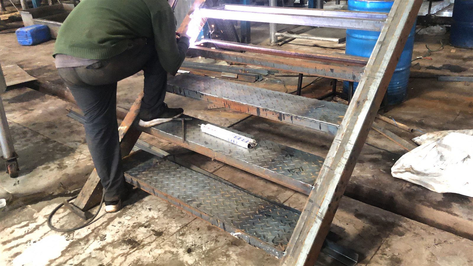 Industrial stair assembly being welded