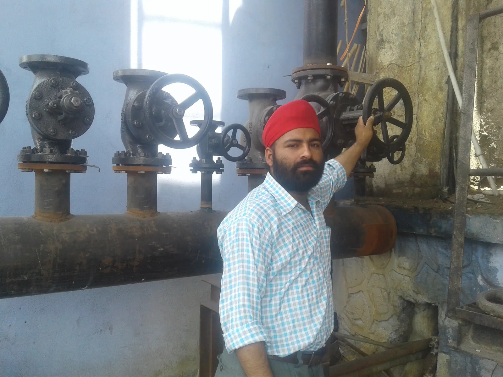 Large industrial valves installed on a boiler steam distribution header