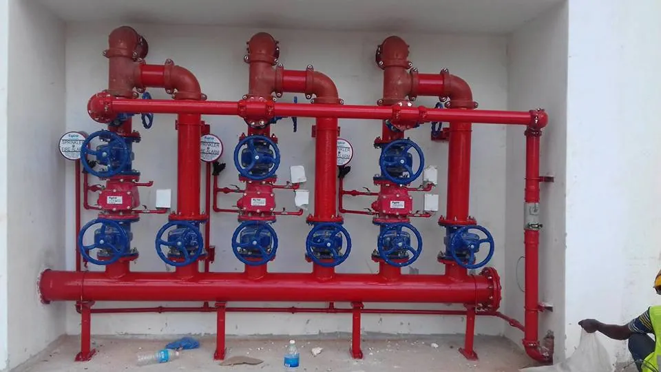Fire-protection pipeline valve header installed in a service enclosure