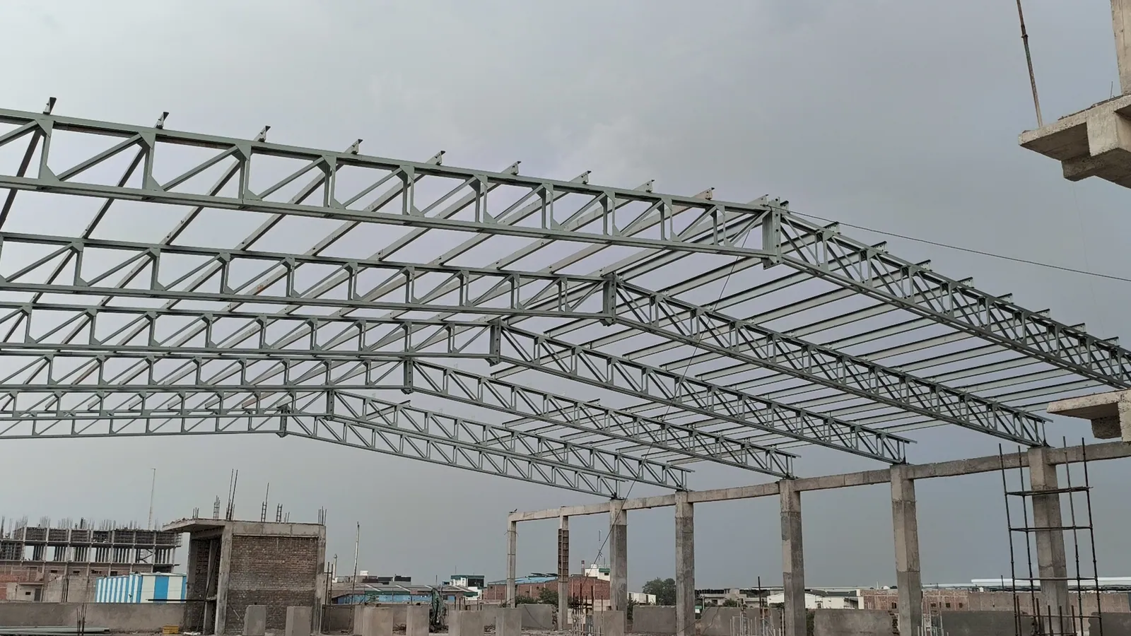 Fabricated and coated steel roof structure installed at an industrial site