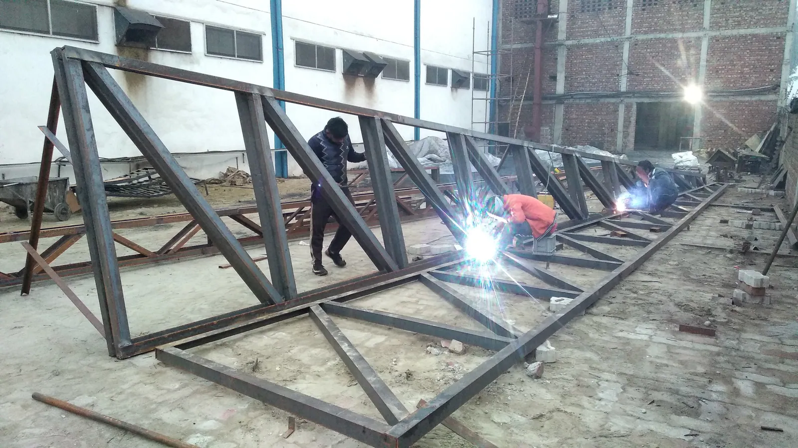 Steel roof truss welding for an industrial shed by LS Metal Works